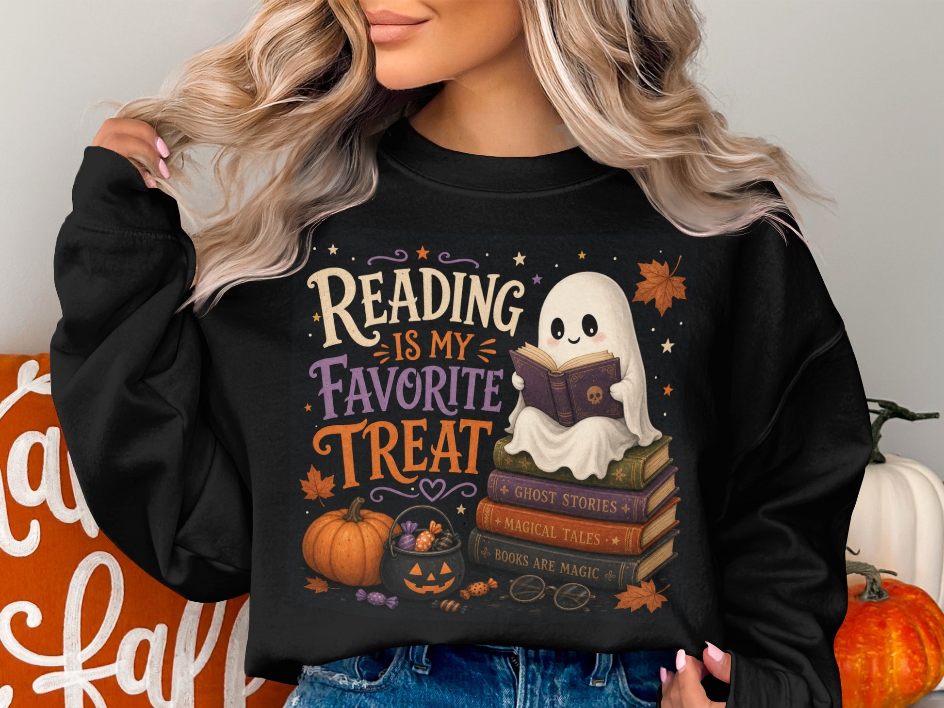 Black sweatshirt with Halloween graphic: ghost reading, books, pumpkin, and candy.