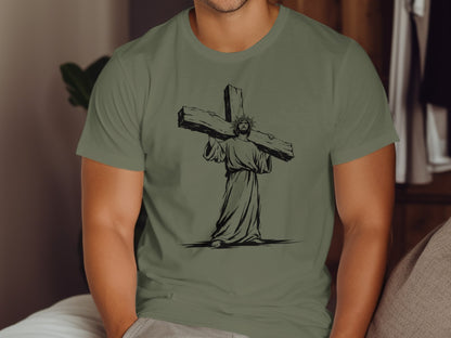 Jesus carrying a large wooden cross, illustration on an olive green t-shirt.