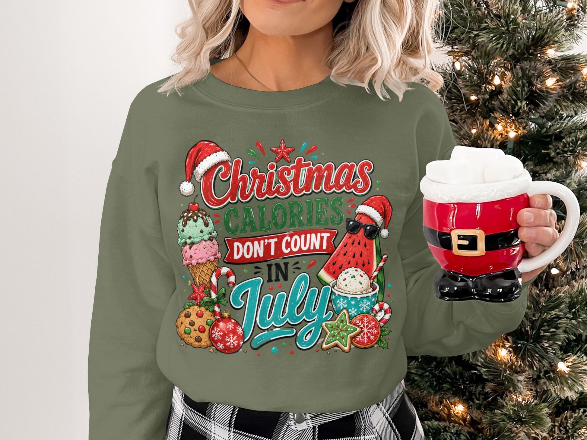Green Christmas sweatshirt with "Christmas Calories Don't Count In July" text and festive treats.