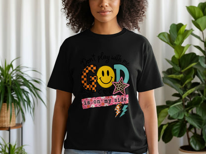 Black t-shirt with graphic that reads "Don't play with me God is on my side".