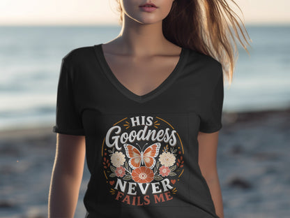 T-shirt with "His Goodness Never Fails Me" text and floral butterfly design.