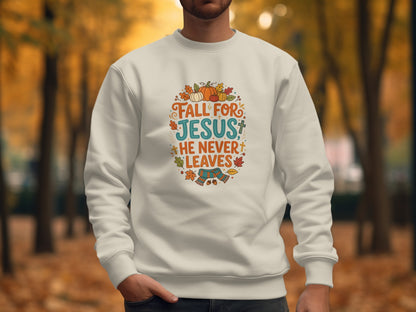 Cream sweatshirt with "Fall for Jesus, He Never Leaves" text and fall graphics.