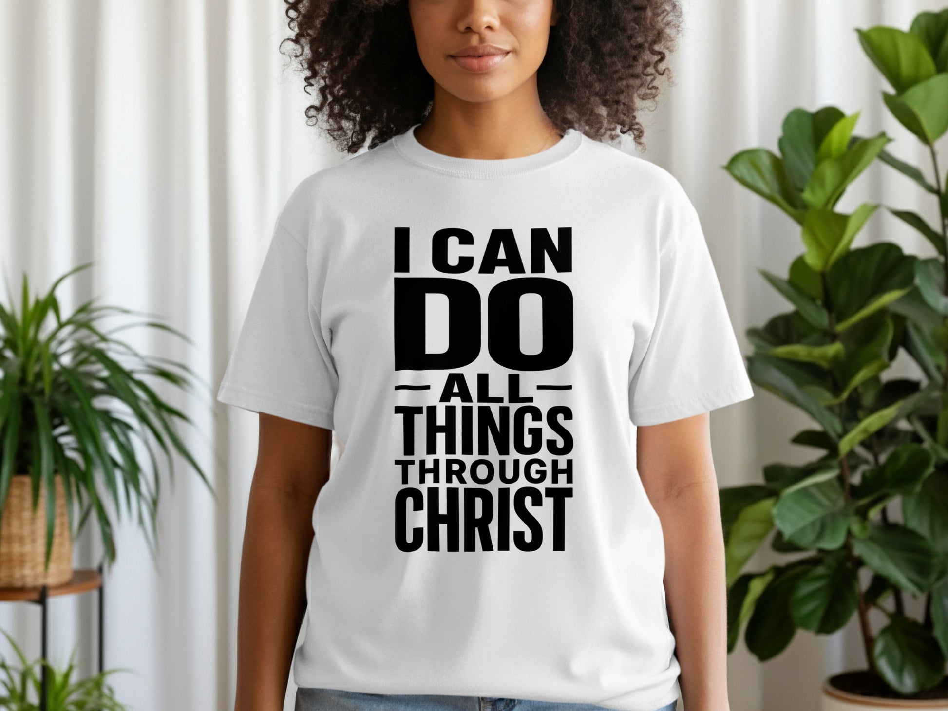 White t-shirt with black text that reads "I CAN DO ALL THINGS THROUGH CHRIST".