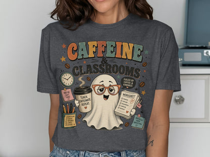 Retro ghost with glasses holds coffee and worksheet on shirt that says "CAFFEINE & CLASSROOMS".