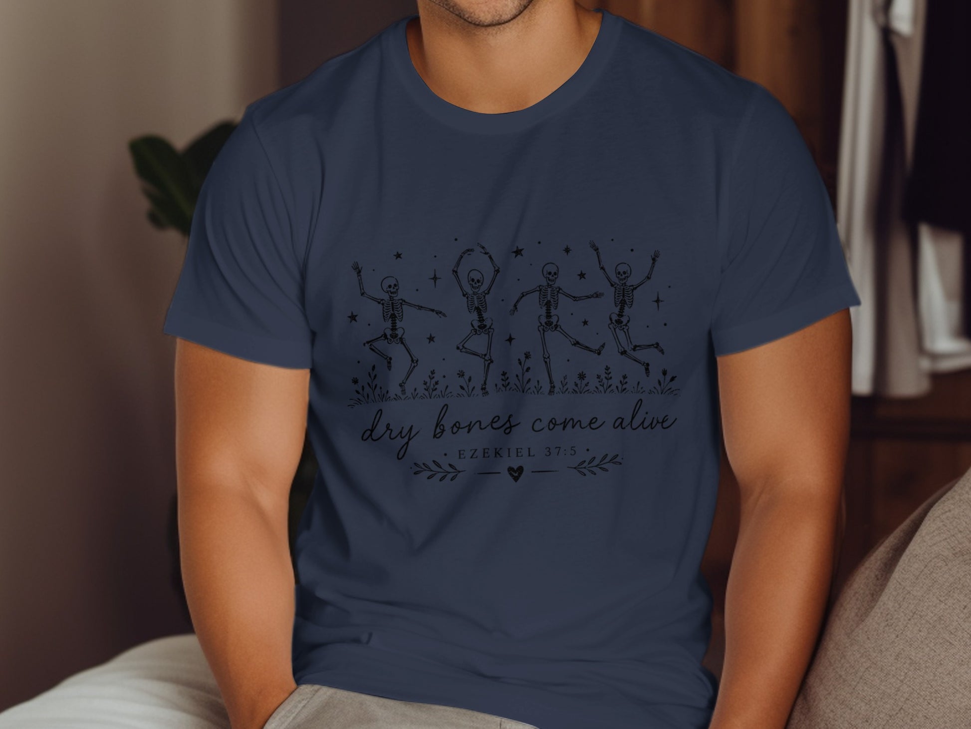 Navy t-shirt with dancing skeletons and "dry bones come alive Ezekiel 37:5" text.