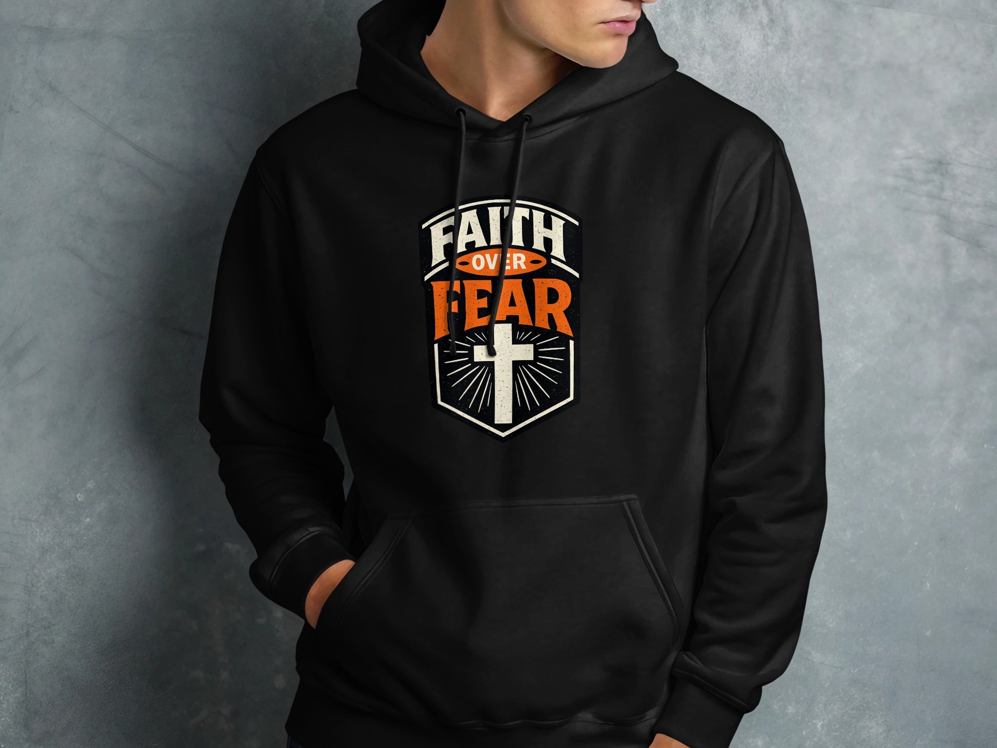 Black hoodie with "Faith Over Fear" and a cross graphic.