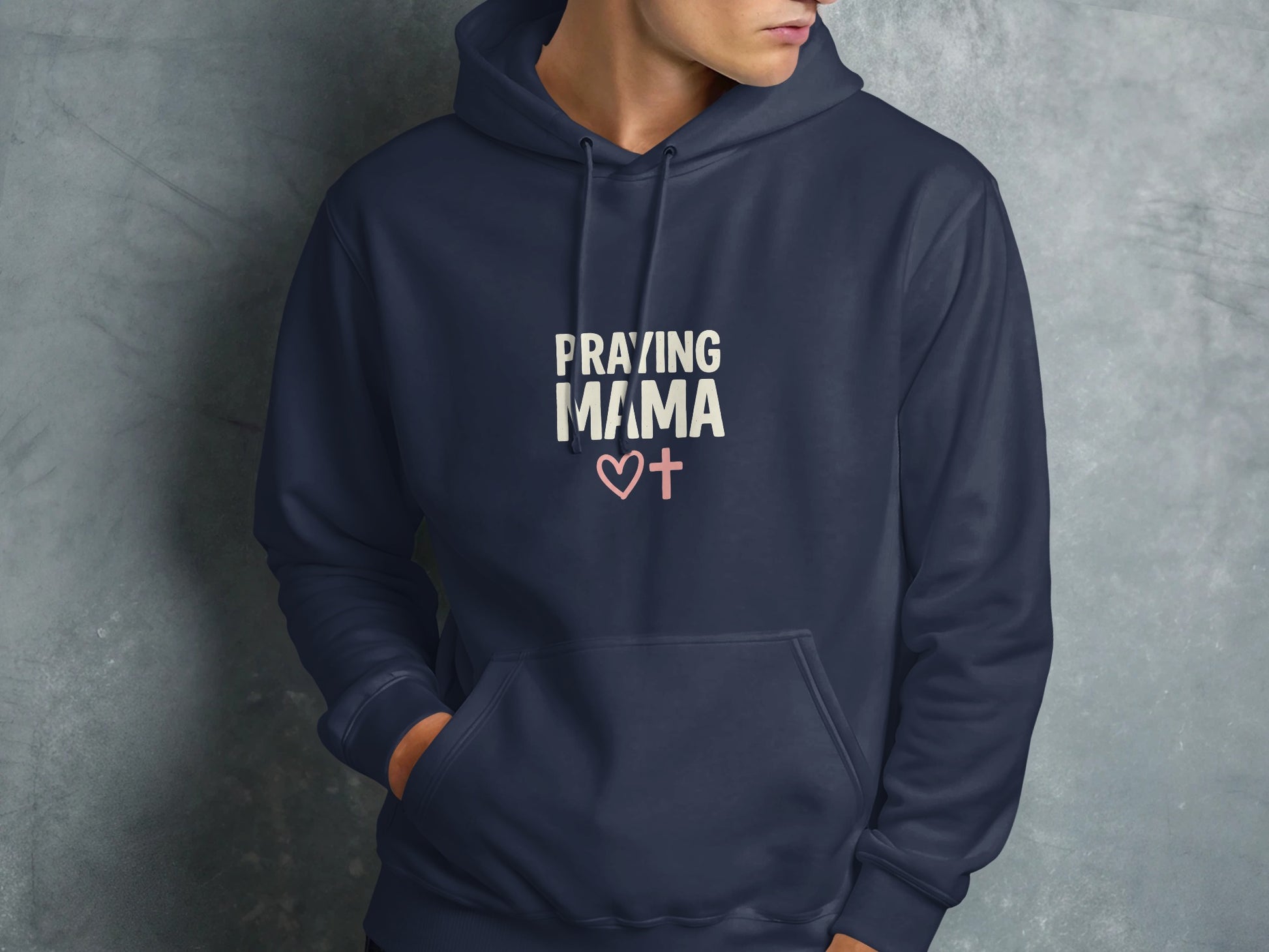 Navy hoodie with "PRAYING MAMA" and heart cross graphic.