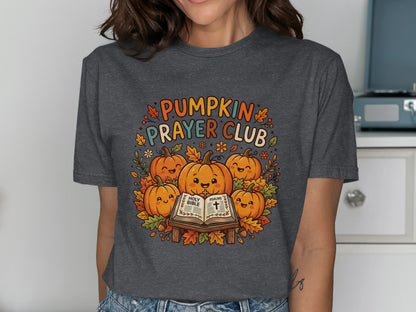 T-shirt featuring pumpkins, autumn leaves, and "Pumpkin Prayer Club" text.