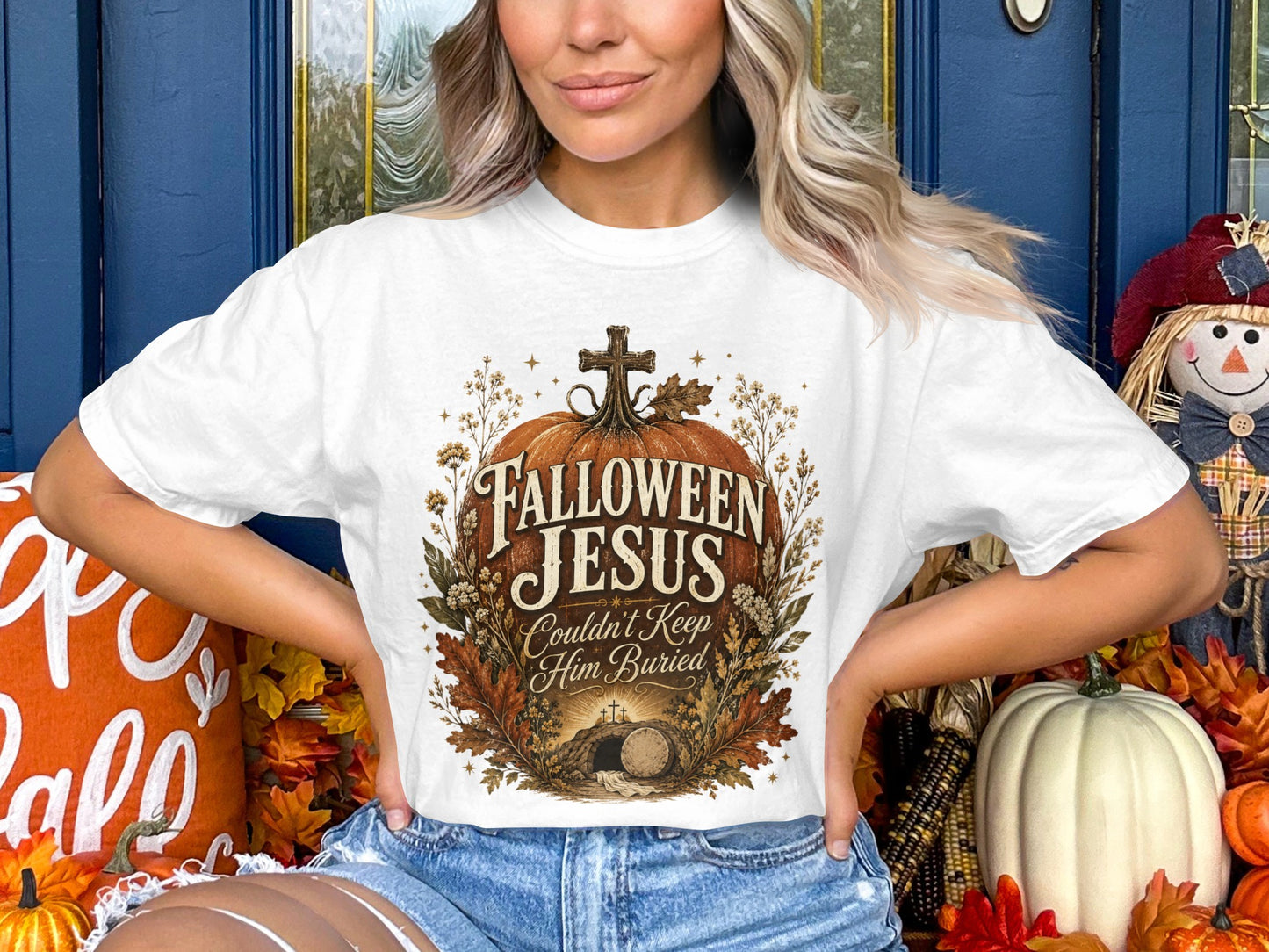 White t-shirt with "Falloween Jesus Couldn't Keep Him Buried" graphic.