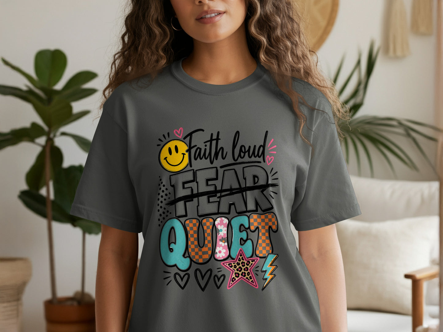 Dark grey t-shirt with "Faith loud, Fear crossed out, Quiet" text and graphics.