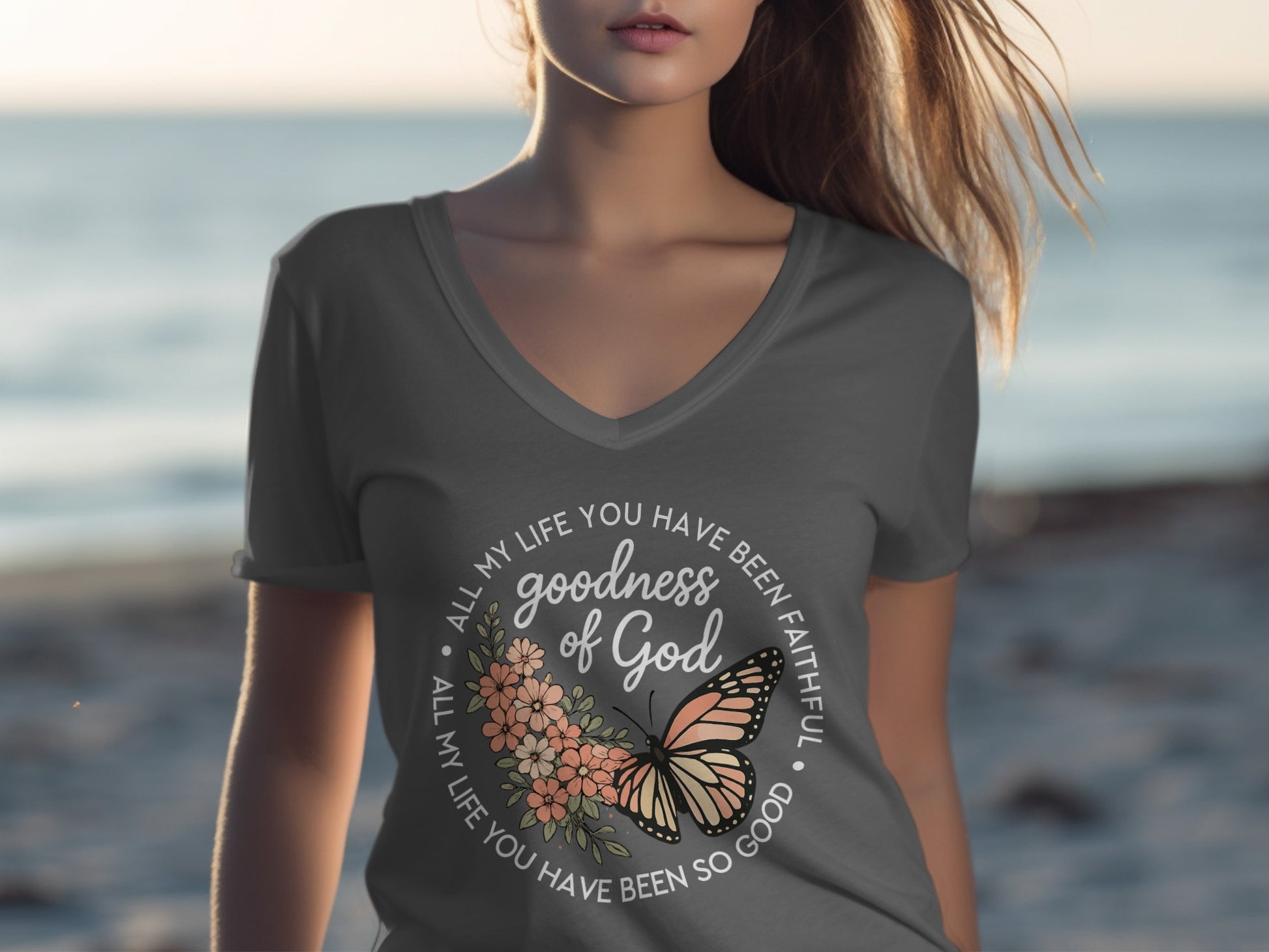 T-shirt with floral and butterfly graphic and text "goodness of God".