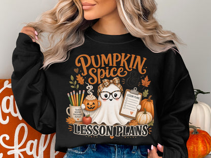 Black sweatshirt with "Pumpkin Spice Lesson Plans" featuring a ghost, pumpkins, and school supplies.