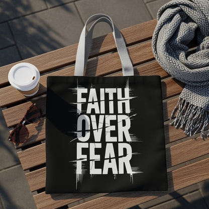 Black tote bag with white text reading "FAITH OVER FEAR" in bold, distressed lettering.