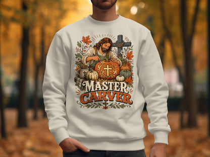 Crewneck sweatshirt featuring Jesus carving a pumpkin with "Master Carver" text.