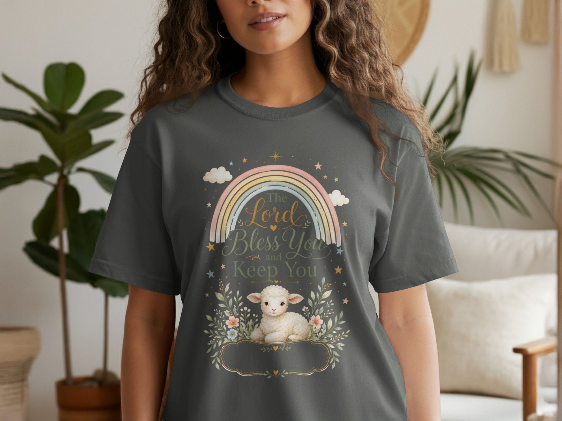 Dark gray t-shirt with a lamb, rainbow, clouds, stars, and text "The Lord Bless You and Keep You".