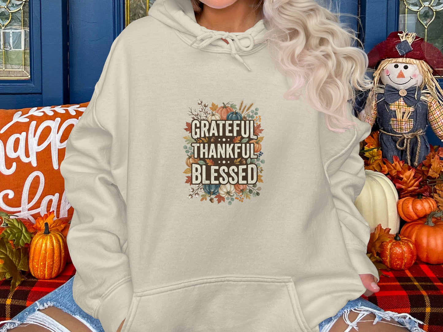 Beige hoodie with "Grateful Thankful Blessed" text and floral accents.