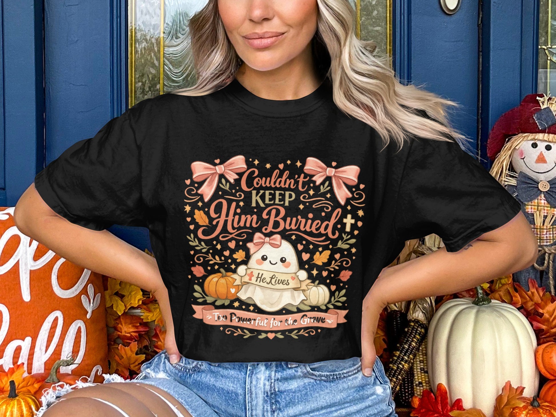 Black t-shirt with ghost graphic: Couldn't Keep Him Buried, He Lives, Too Powerful for the Grave.