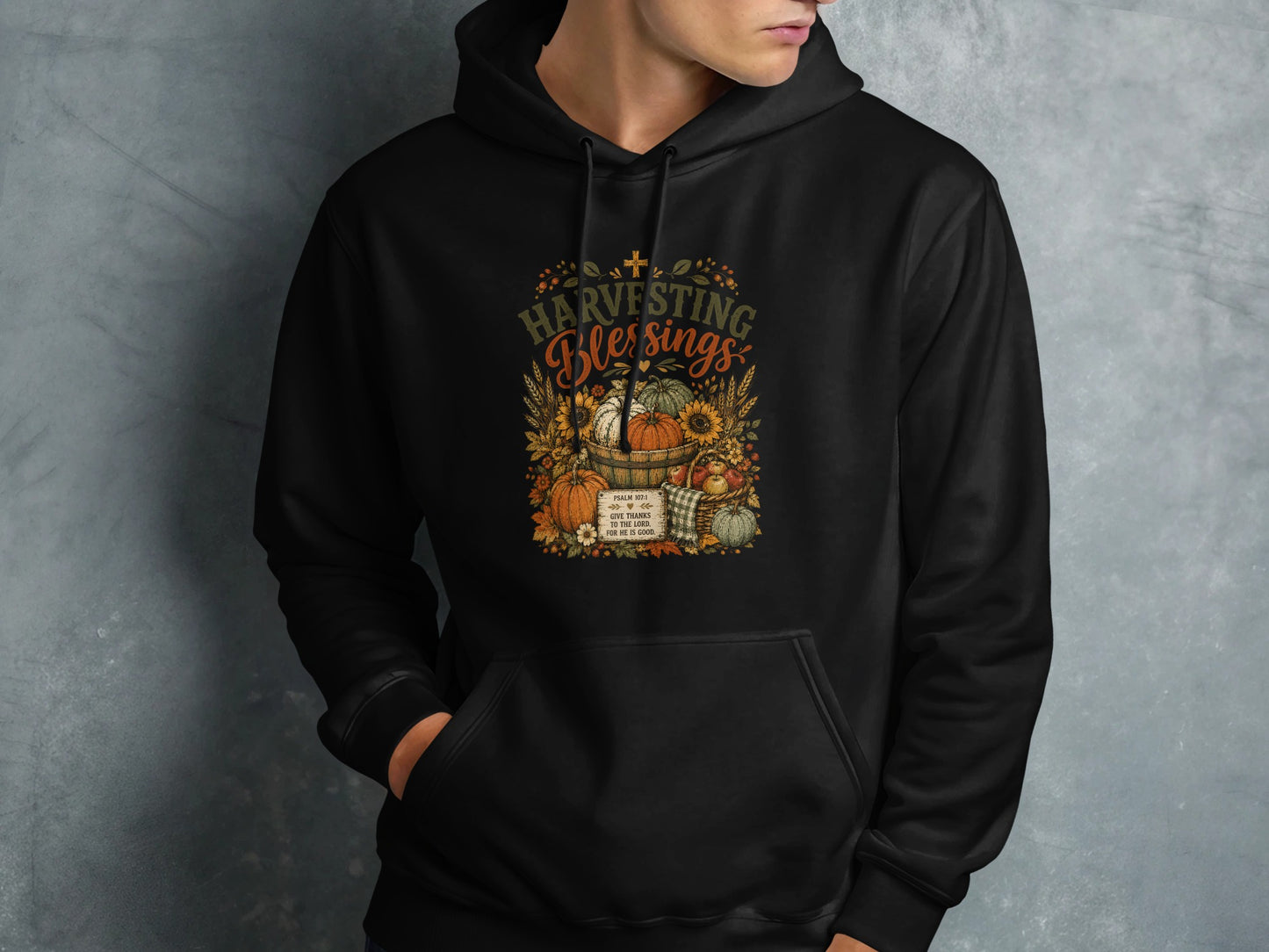 Black hoodie with "Harvesting Blessings" and Psalm 107:1.