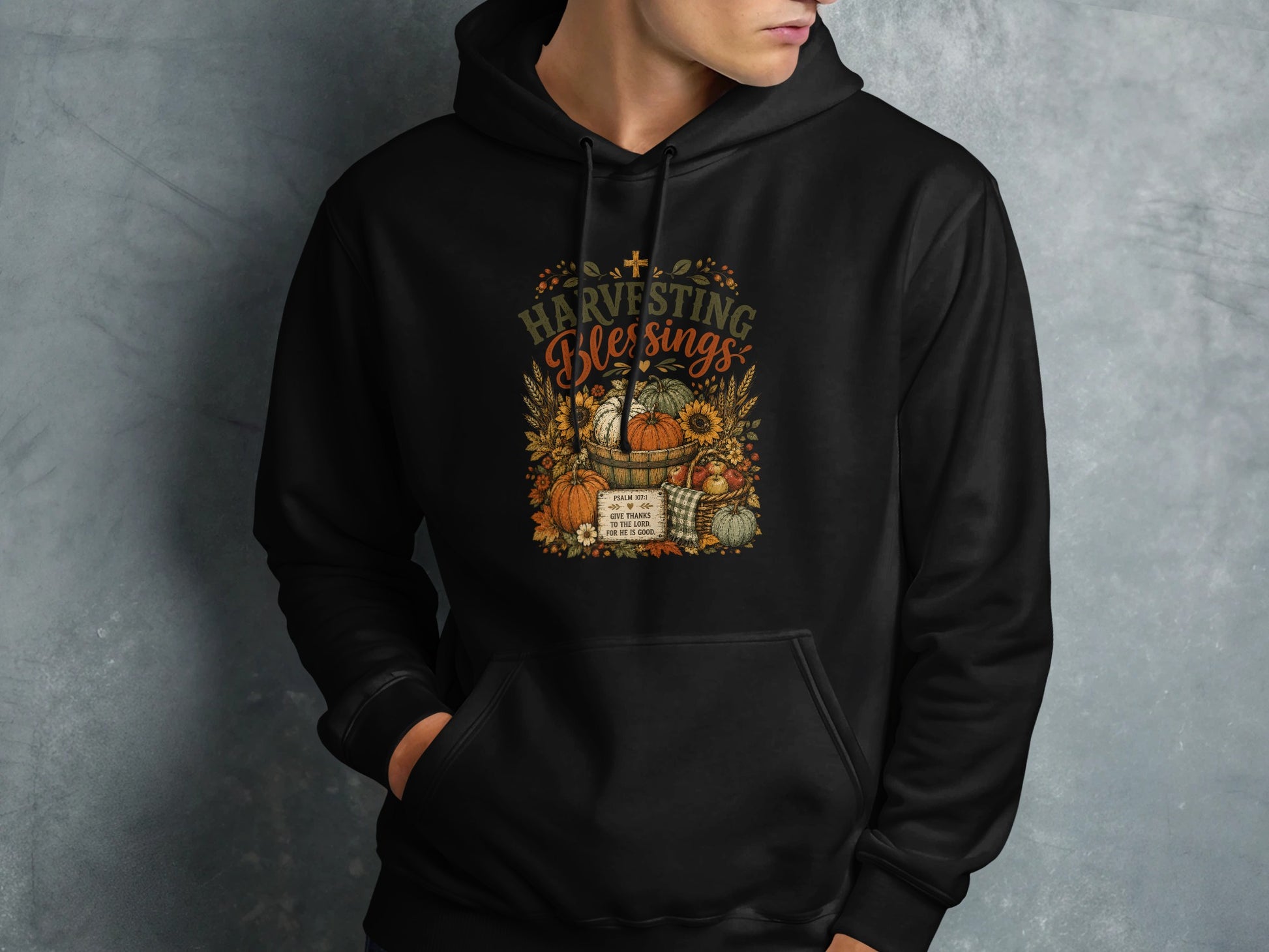 Black hoodie with "Harvesting Blessings" and Psalm 107:1.