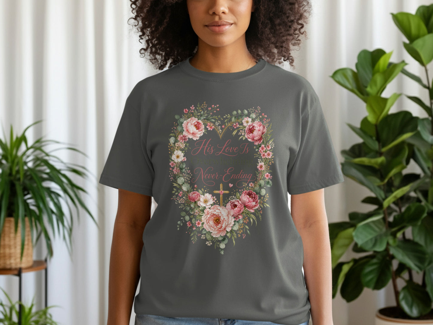 Dark grey t-shirt with floral heart graphic and text "His Love Is Overwhelming, Never-Ending".