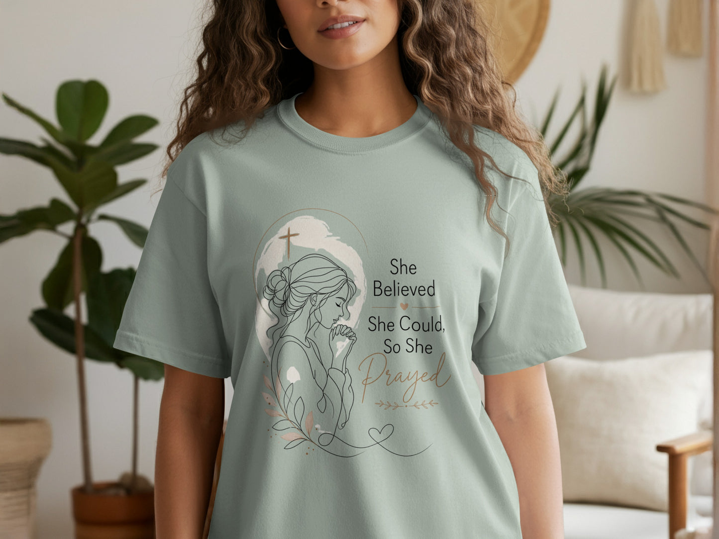 T-shirt with line art of praying woman and text "She Believed, She Could, So She Prayed."