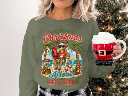 Woman wearing Christmas sweatshirt with reindeer lifeguard on beach.