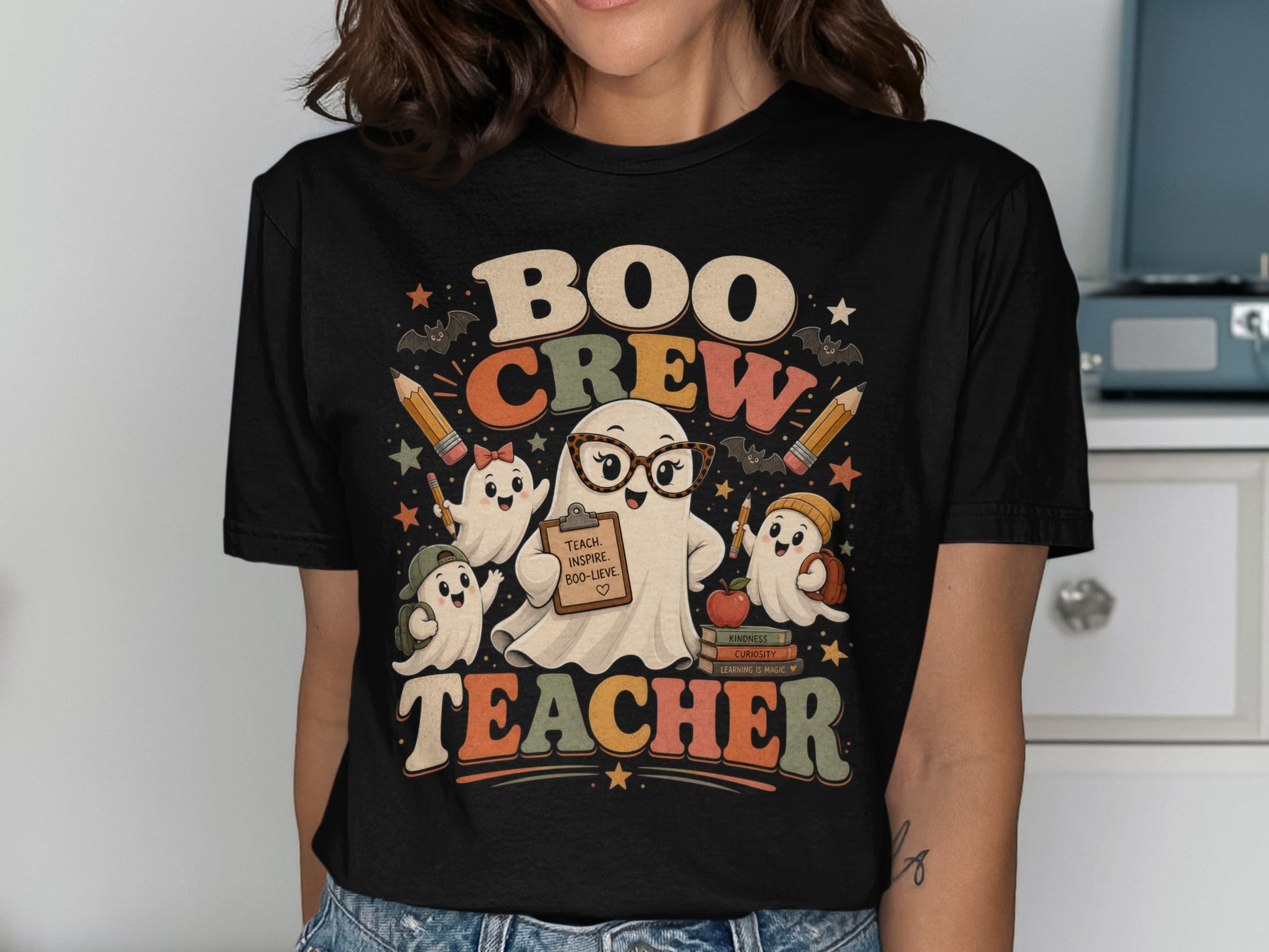 Boo Crew Teacher graphic with ghosts, pencils, bats, and books.