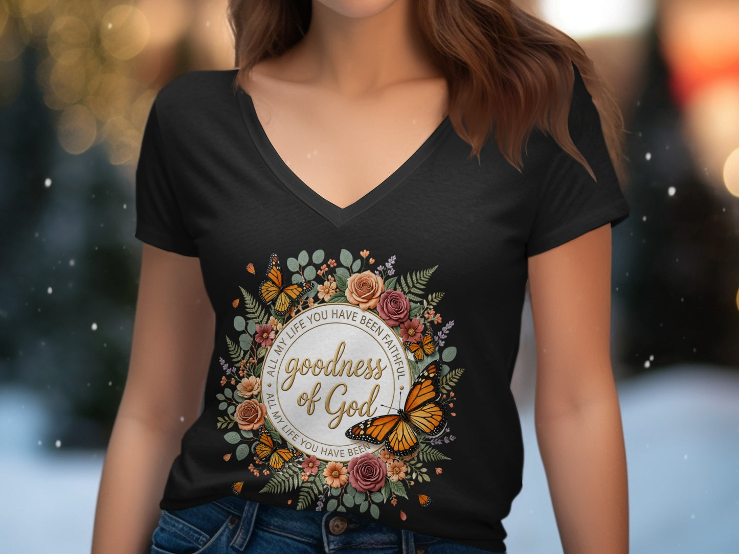 T-shirt with floral wreath, butterflies, and text "Goodness of God".