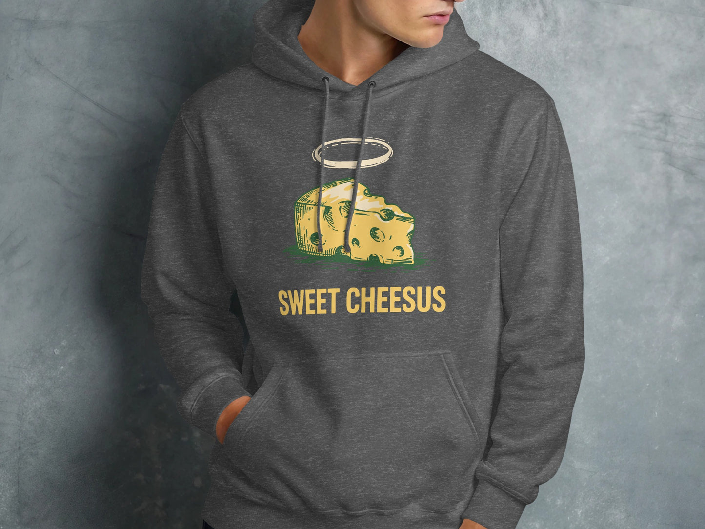 Dark grey hoodie with "Sweet Chesus" text and a haloed slice of Swiss cheese graphic.
