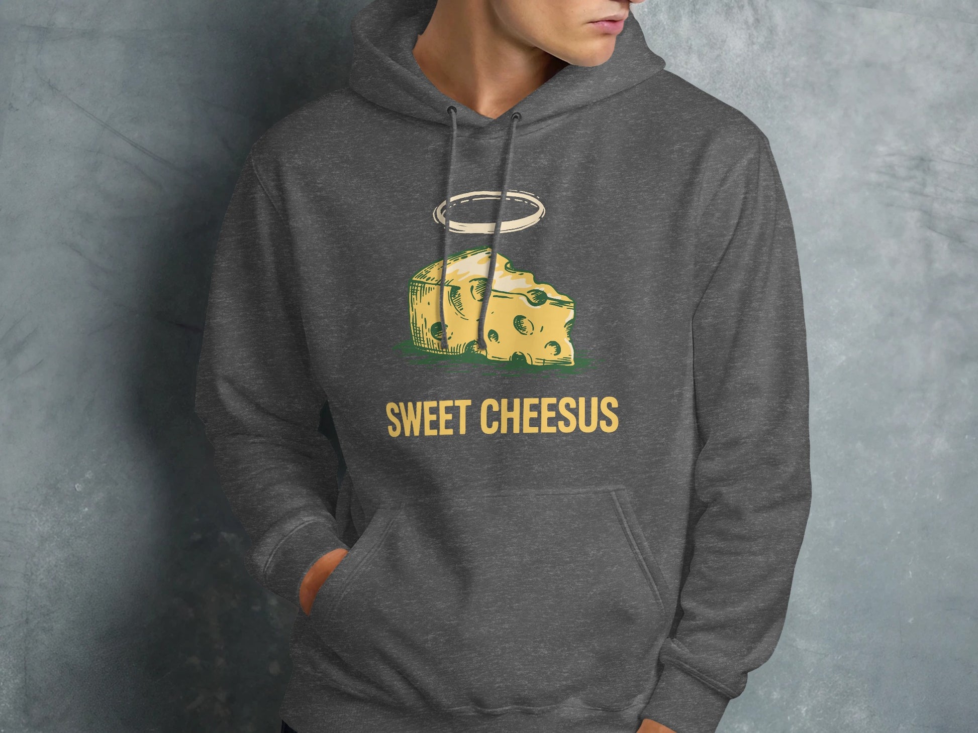 Dark grey hoodie with "Sweet Chesus" text and a haloed slice of Swiss cheese graphic.