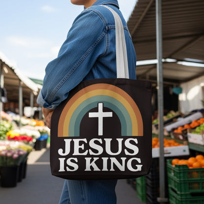Tote bag with rainbow and cross design saying "JESUS IS KING".