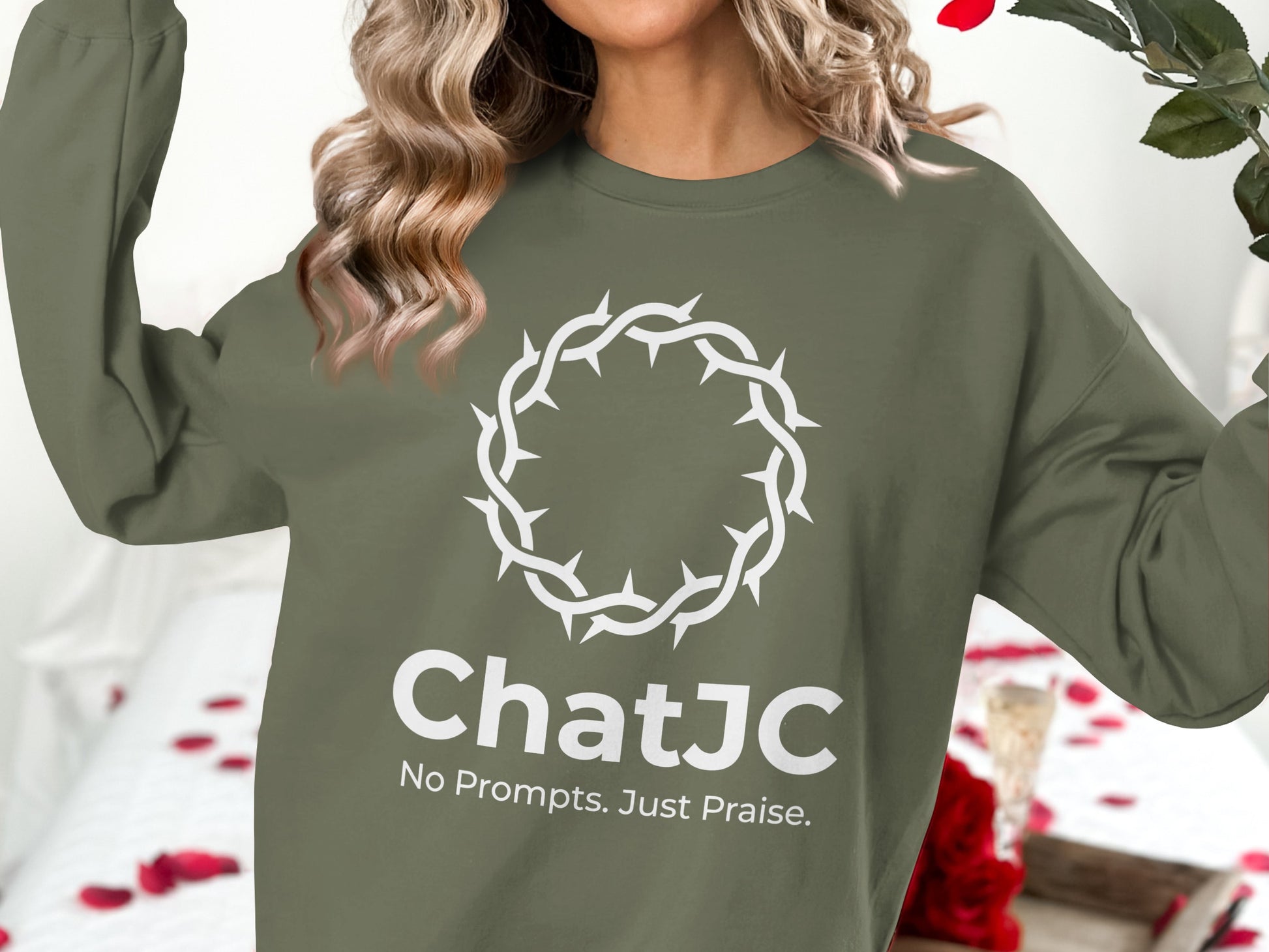 Olive green sweatshirt with "ChatJC" and "No Prompts. Just Praise." text and a crown of thorns graphic.