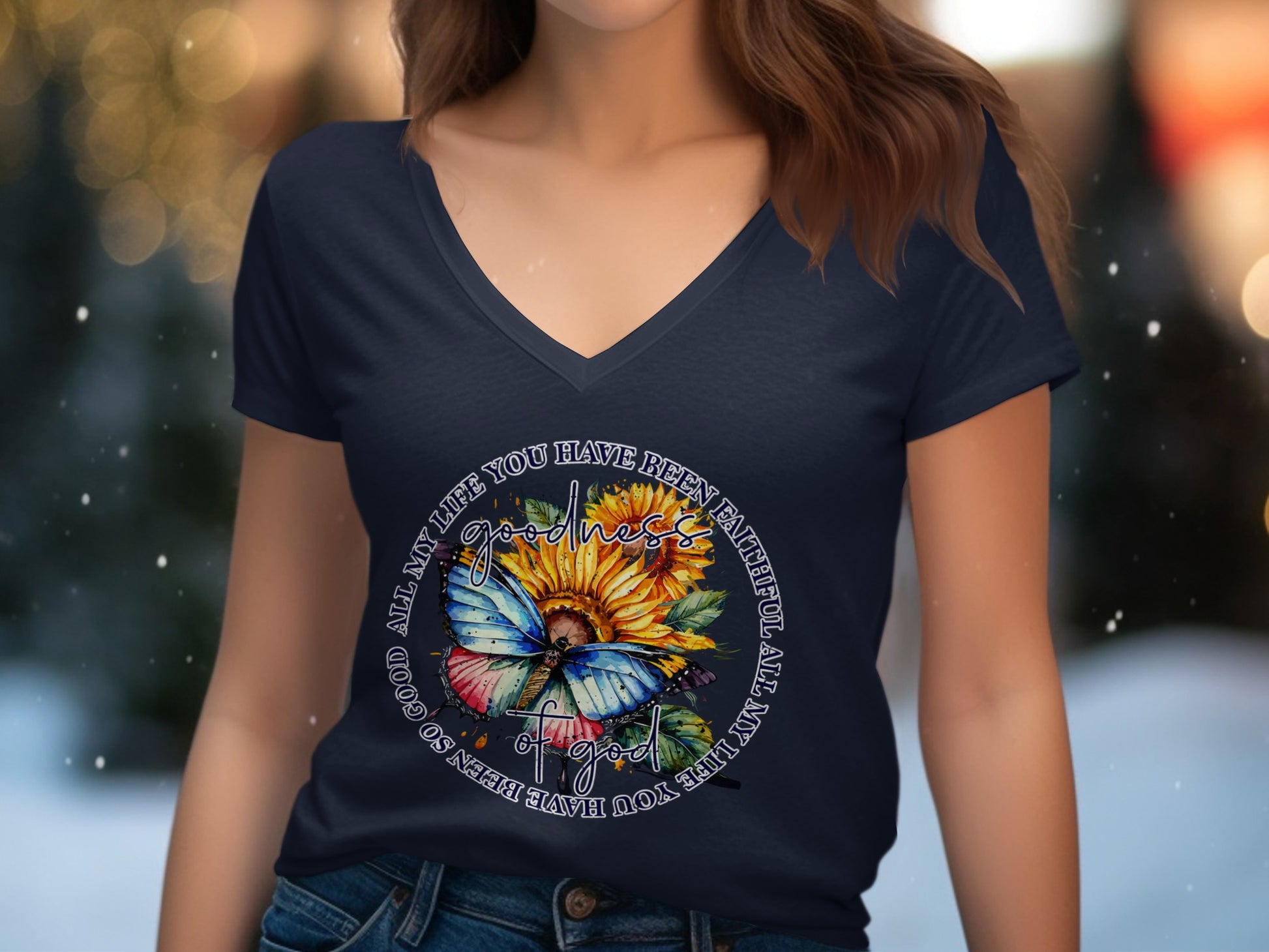 Navy t-shirt with sunflower and butterfly graphic featuring text.
