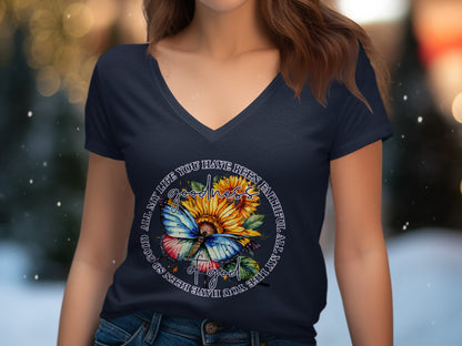 Navy t-shirt with sunflower and butterfly graphic featuring text.
