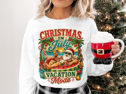 Sweater with "Christmas in July Vacation Mode" text featuring Santa on a watermelon float.