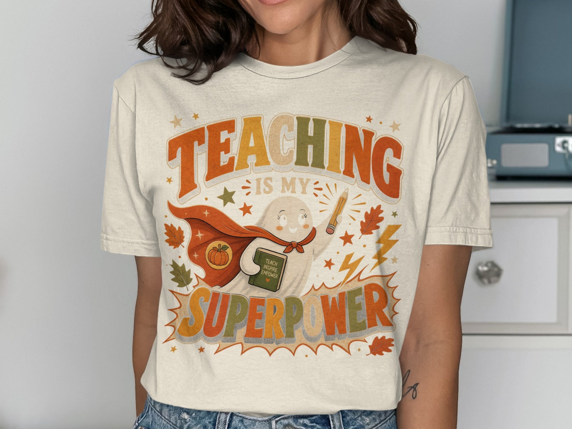 Ghost with cape holding book reads "Teaching is my superpower"