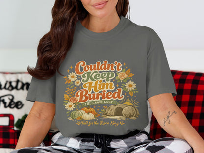 Gray t-shirt with "Couldn't Keep Him Buried, The Grave Lost" and "Fall for the Risen King" text.