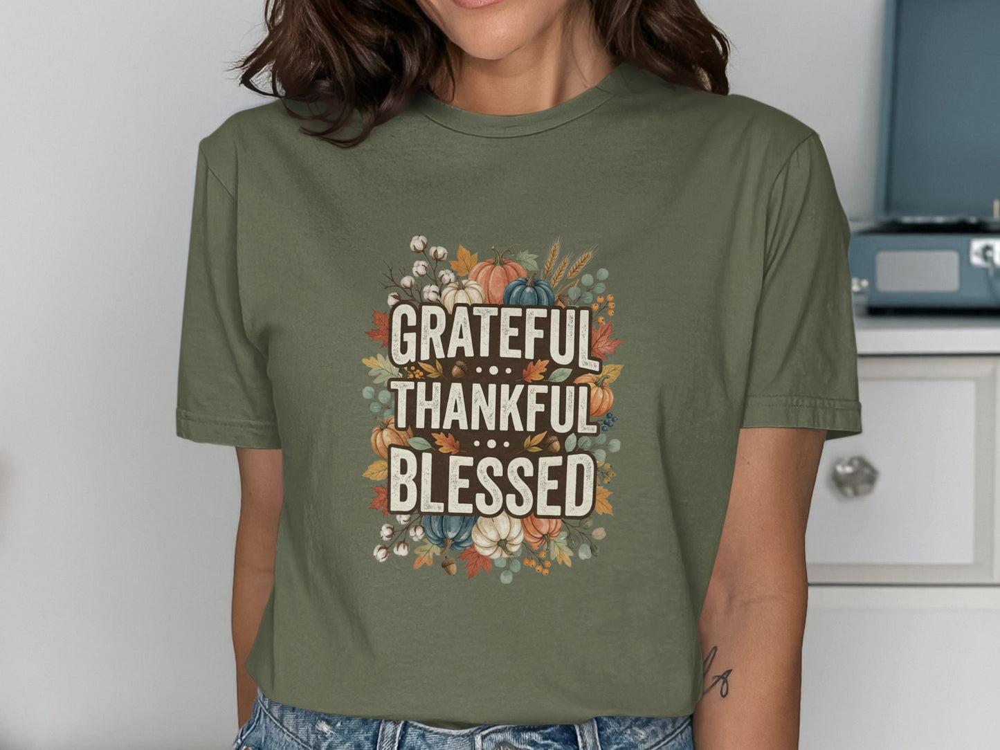 Olive green t-shirt with "Grateful Thankful Blessed" and autumn illustrations.