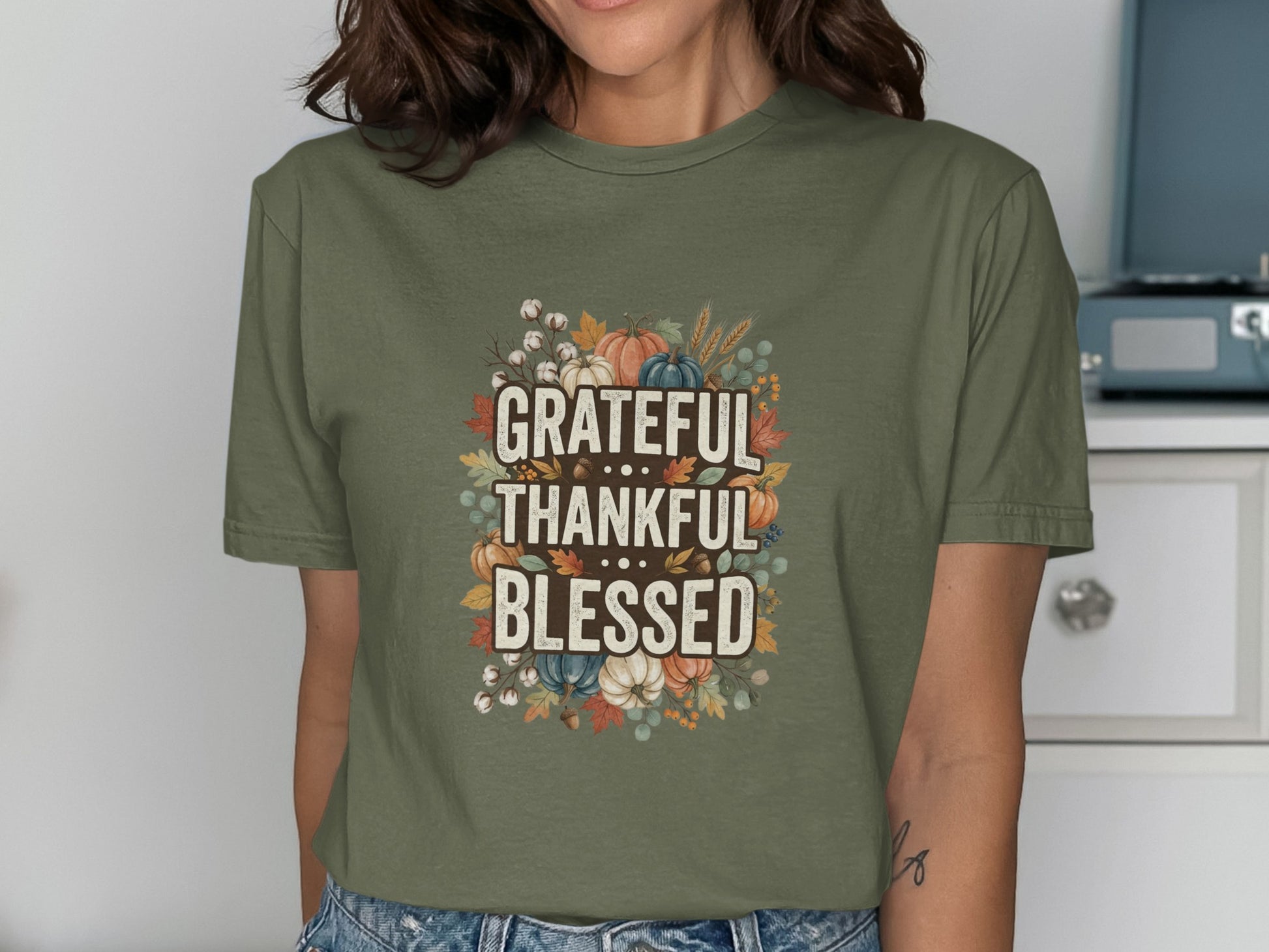 Olive green t-shirt with "Grateful Thankful Blessed" and autumn illustrations.