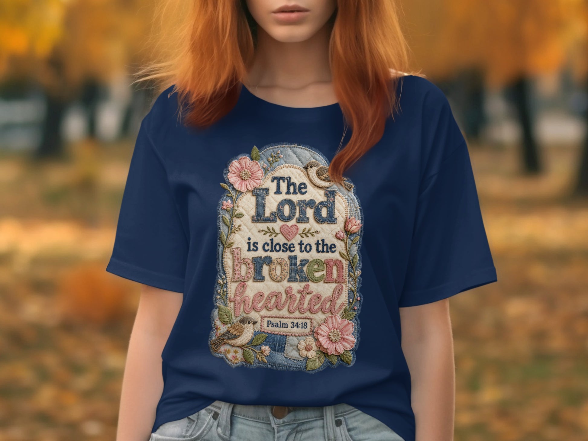 Navy t-shirt with "The Lord is close to the brokenhearted" Bible verse design.