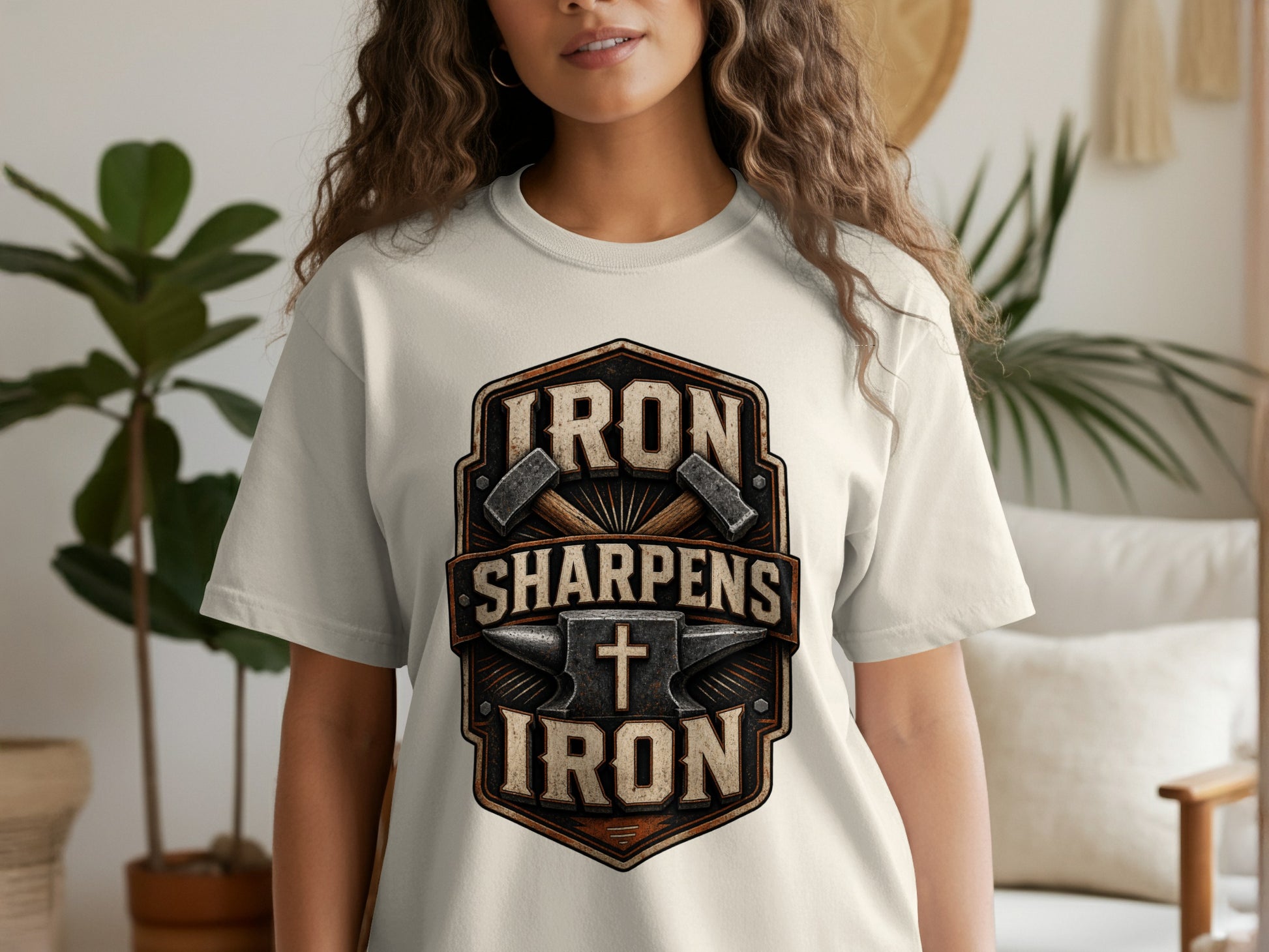T-shirt with "Iron Sharpens Iron" text, anvil, hammers, and cross design.
