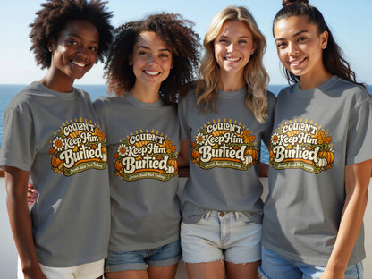 Four women wear grey t-shirts with "Couldn't Keep Him Burtied Jesus Said Not Today" text.