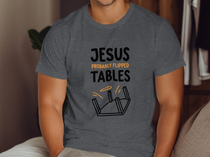 Dark gray t-shirt with "JESUS PROBABLY FLIPPED TABLES" text and overturned table graphic.