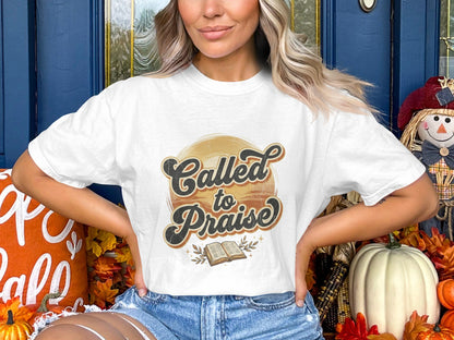 White t-shirt with "Called to Praise" text and open book graphic.