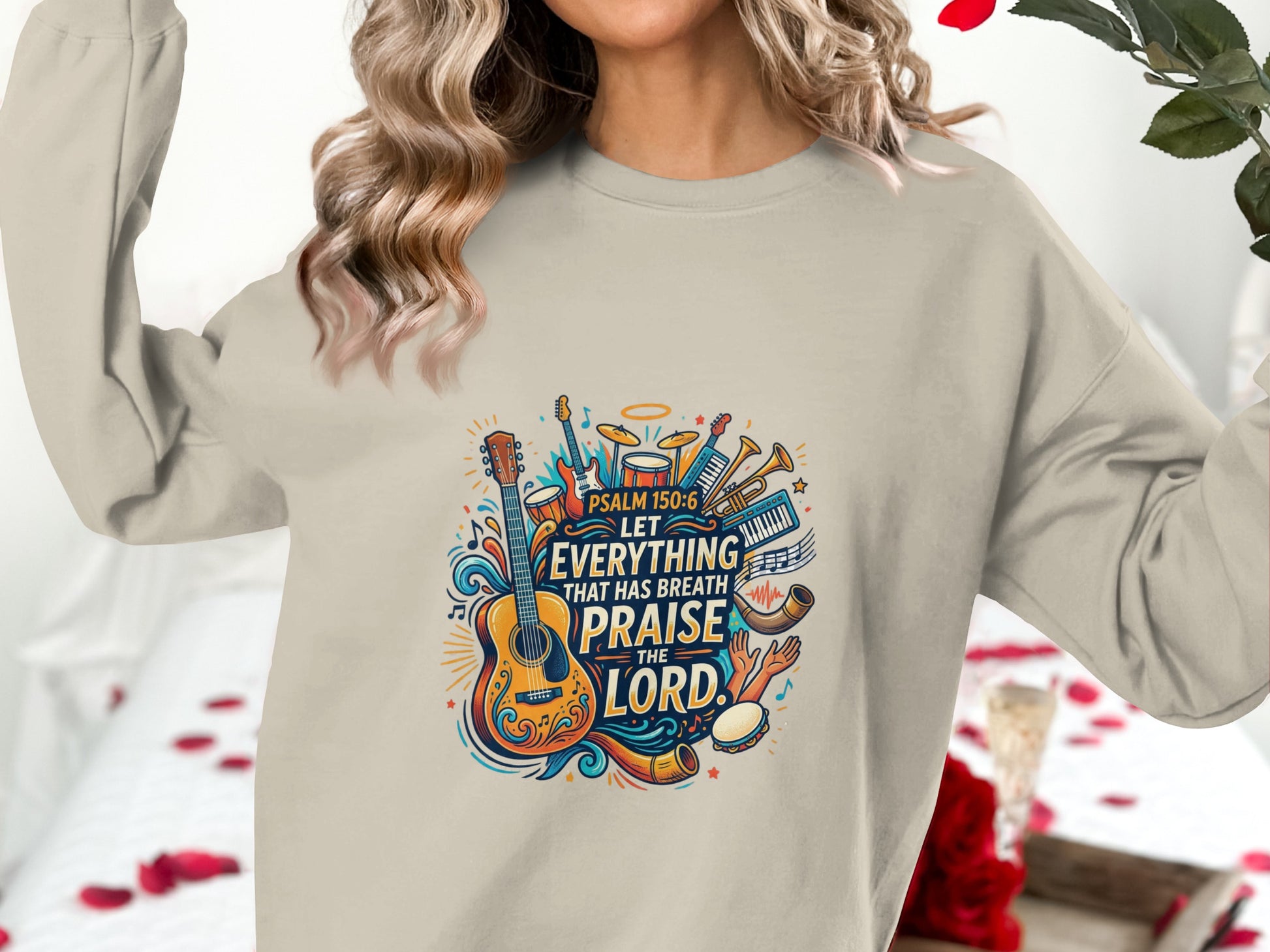 Crewneck sweatshirt with colorful musical instruments and "Psalm 150:6 Let Everything That Has Breath Praise the Lord" text.