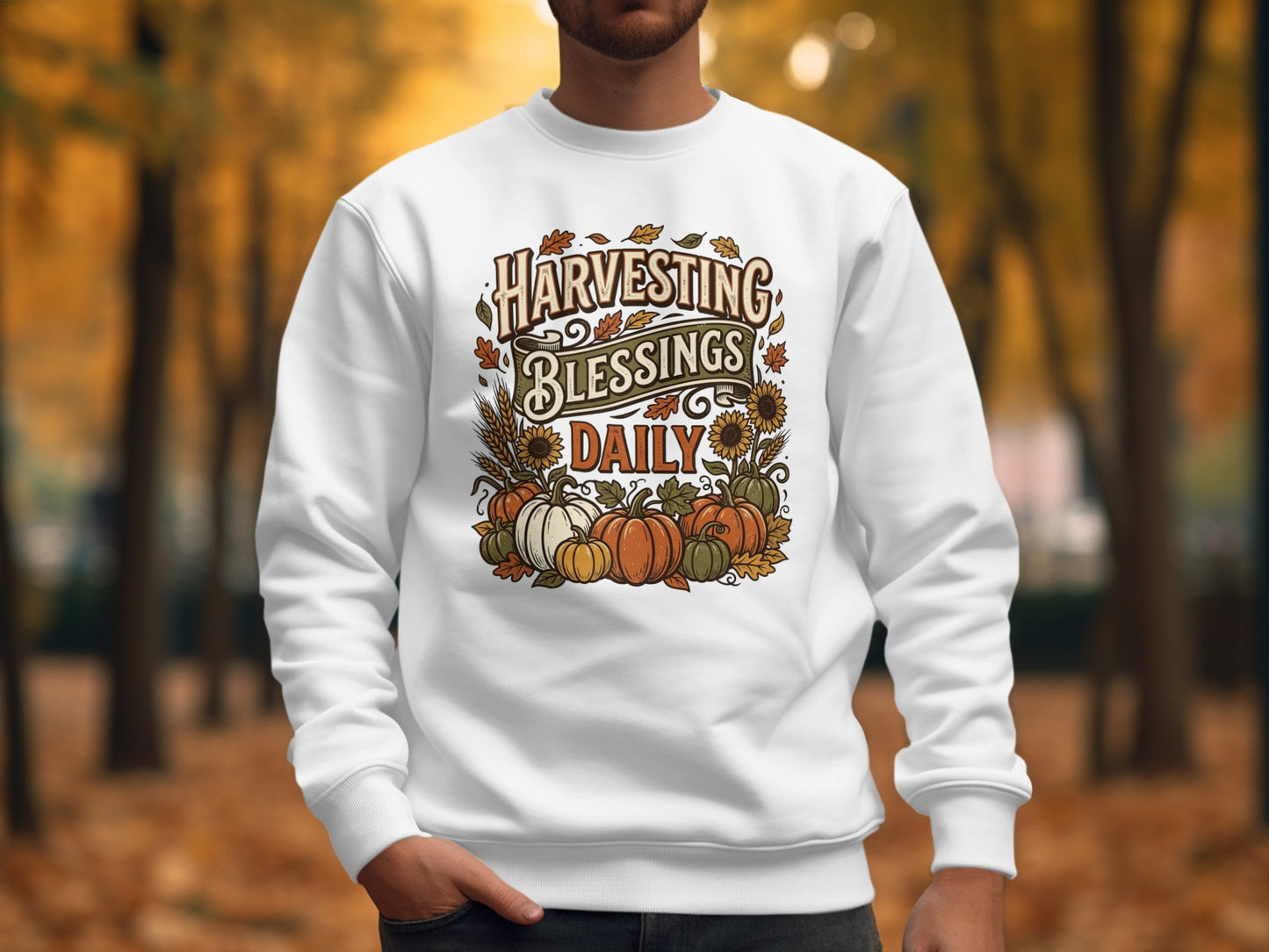 White sweatshirt with "Harvesting Blessings Daily" text and fall pumpkins and sunflowers.
