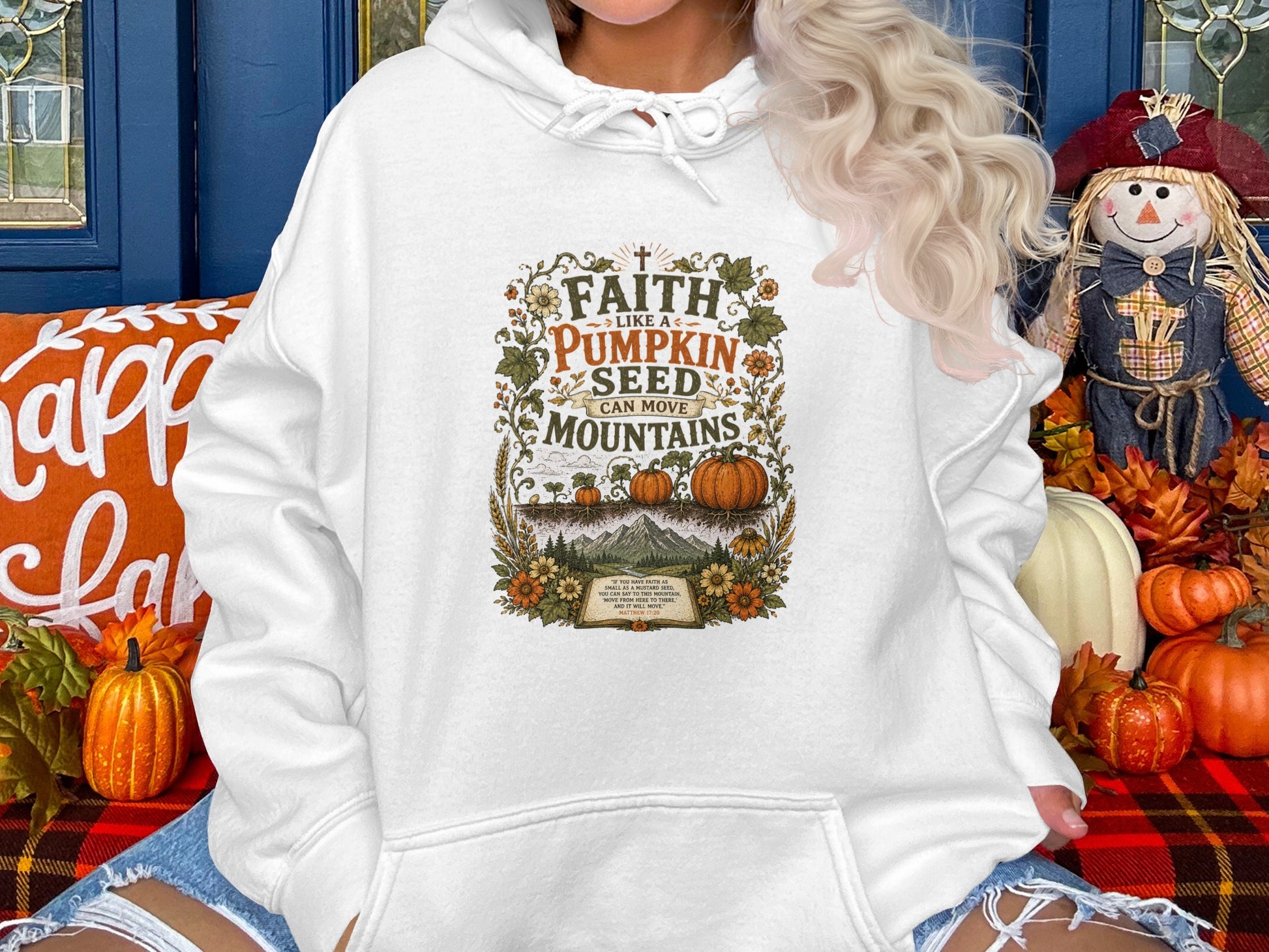 White hoodie with "Faith like a Pumpkin Seed" graphic, biblical quote.