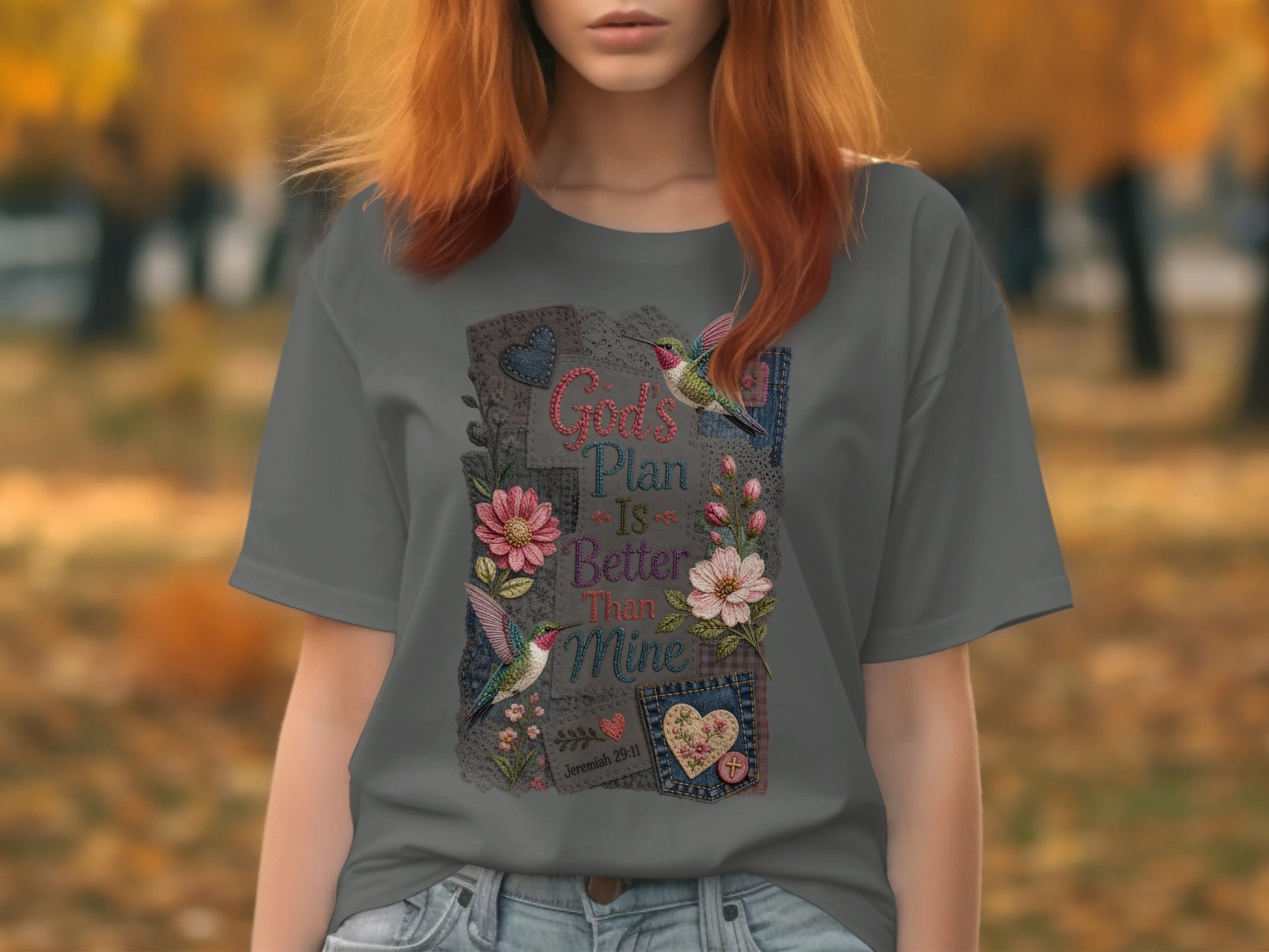 Gray t-shirt with "God's Plan is Better Than Mine" floral and hummingbird graphic.