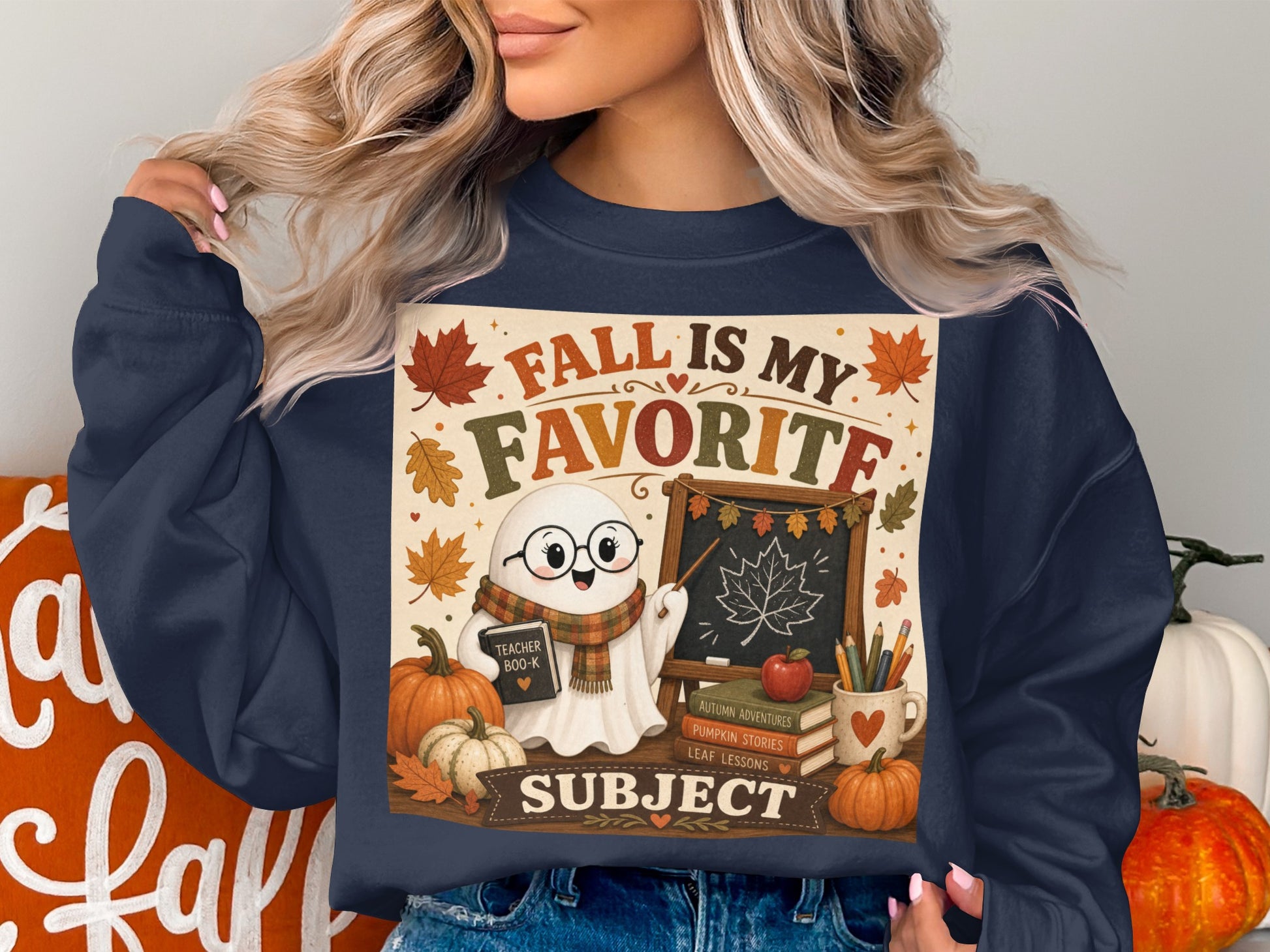 Ghost holding a book and pointing to a blackboard with "Fall is my favorite subject".