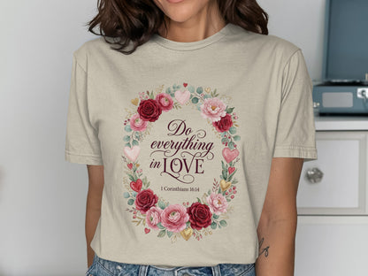Cream t-shirt with floral wreath and "Do everything in love" text.